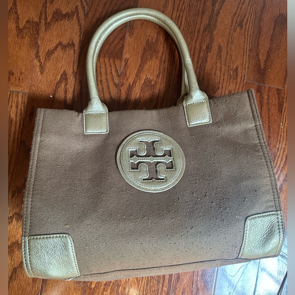 Tory Burch Ella tote features a wool canvas body with gold leather trim & handle